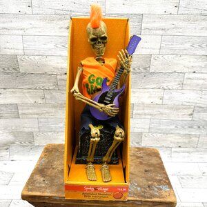 Brand NIB Spooky Village Animated Skeleton w/Instrument Plays Guitar